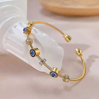 Gold cable bracelet with evil eye and cubic zirconia charms-Vellura Jewellery