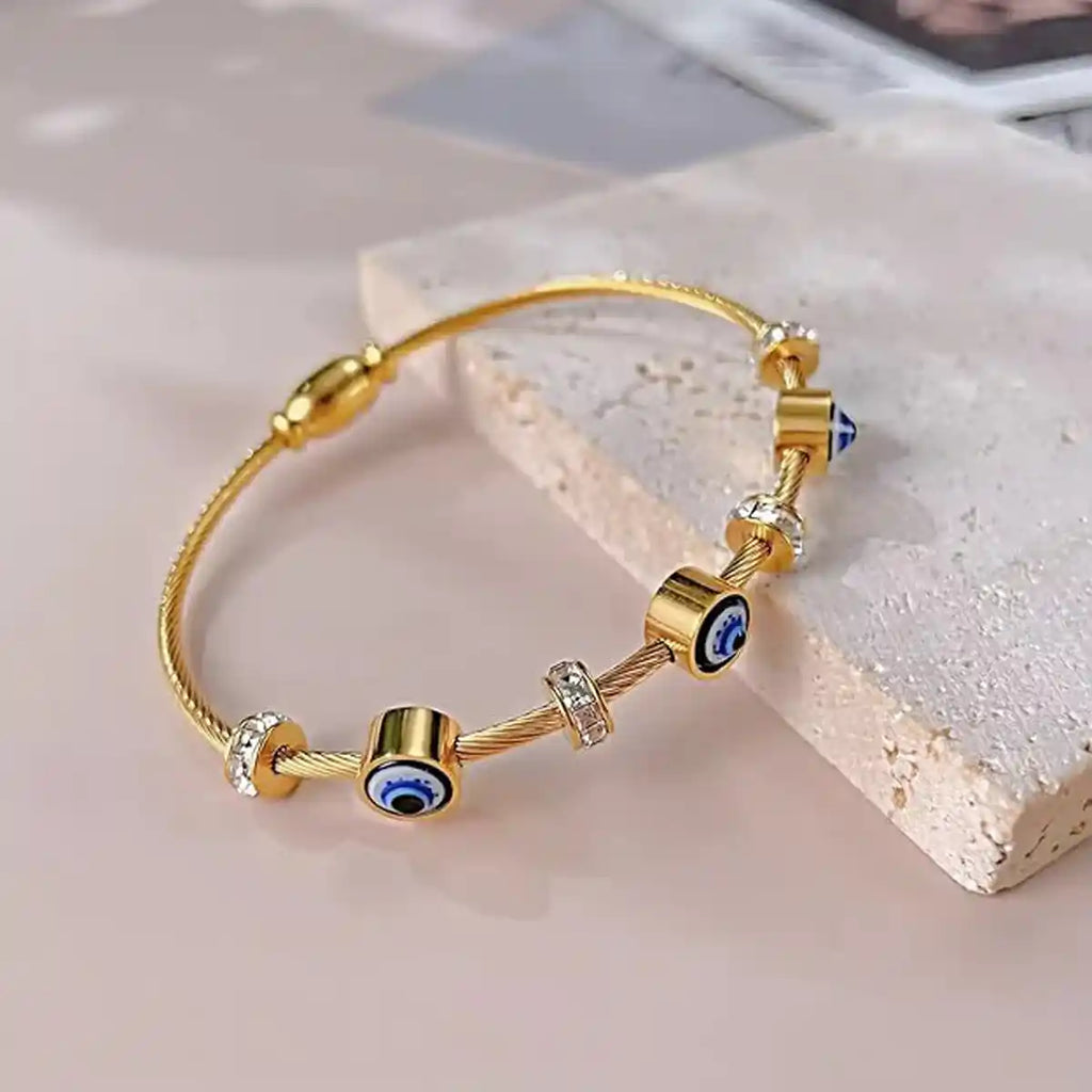 Gold cable bracelet with evil eye and cubic zirconia charms-Vellura Jewellery