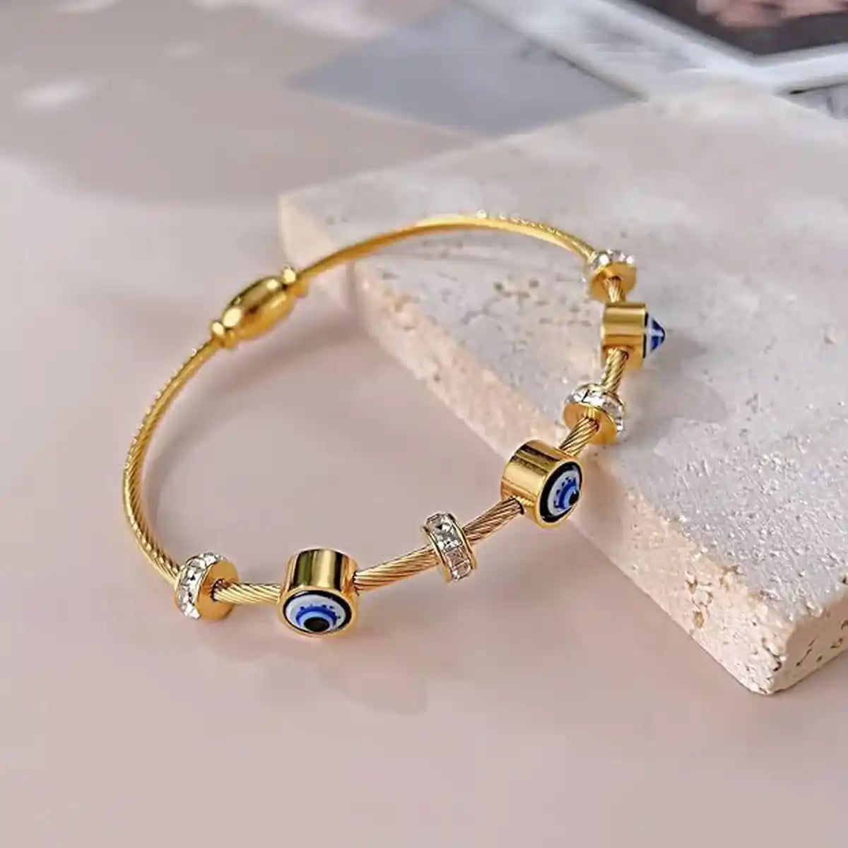 Gold cable bracelet with evil eye and cubic zirconia charms-Vellura Jewellery