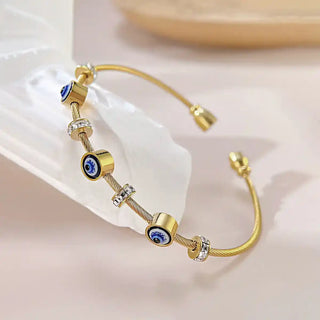 Gold cable bracelet with evil eye and cubic zirconia charms-Vellura Jewellery