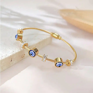 Gold cable bracelet with evil eye and cubic zirconia charms-Vellura Jewellery