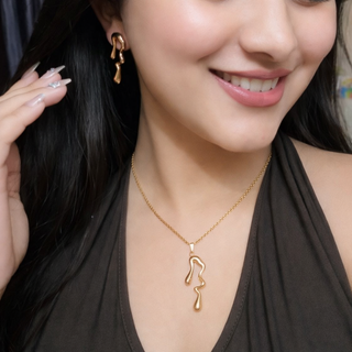 Elegant Abstract Gold Pendant & Earrings Set