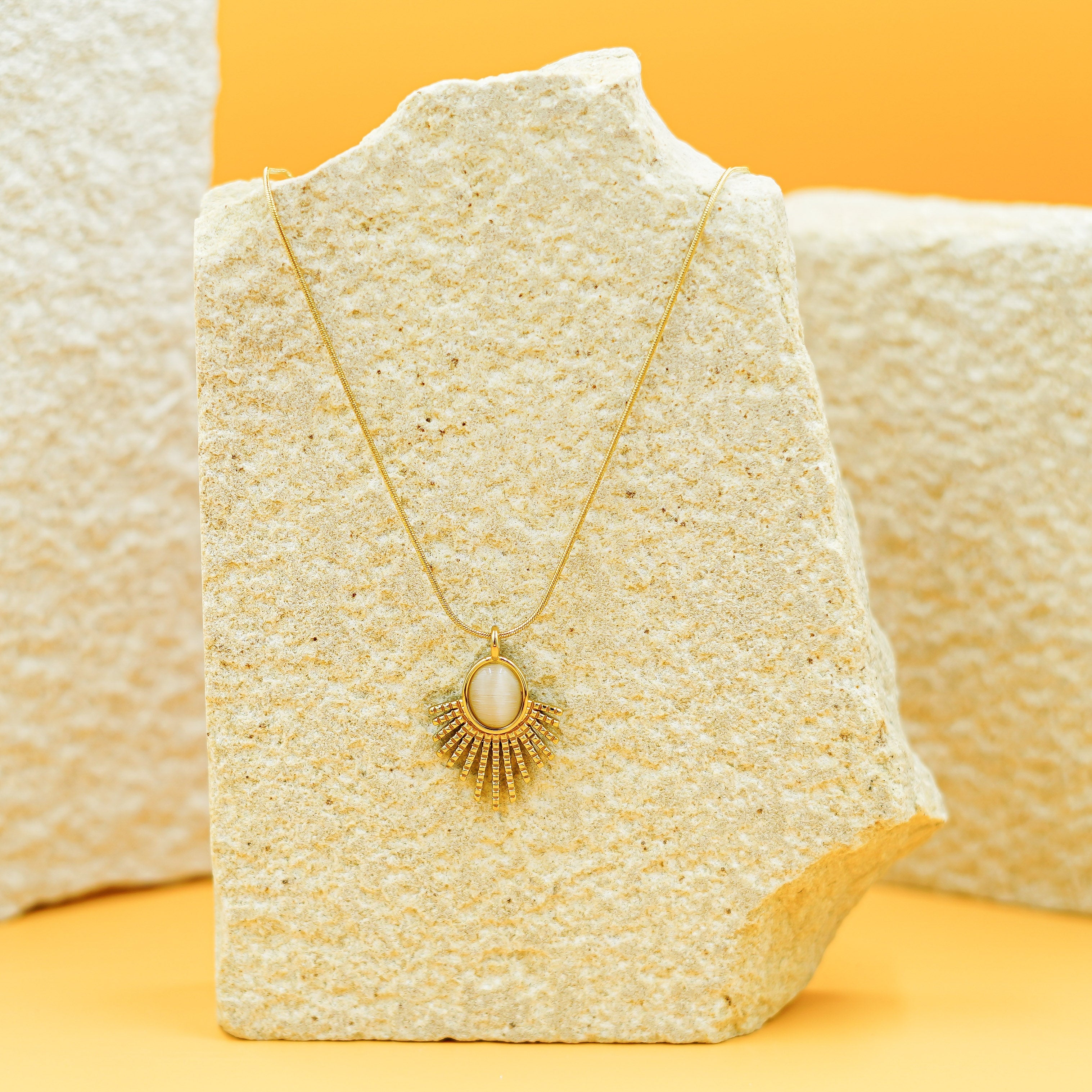 Elegant Gold Sunburst Pendant Necklace with Oval Stone Vellura Jewellery