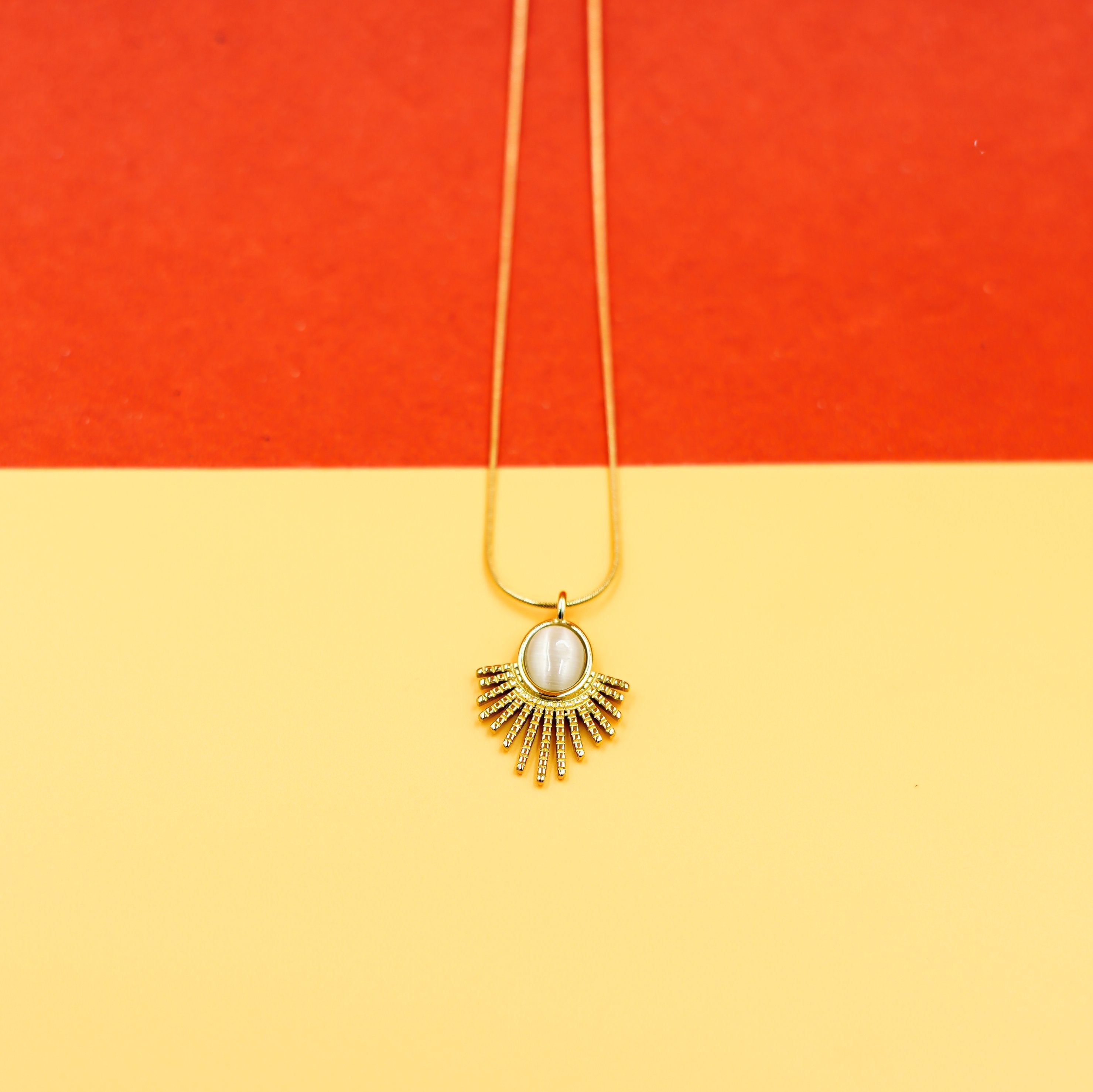 Elegant Gold Sunburst Pendant Necklace with Oval Stone Vellura Jewellery