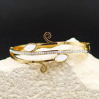 Elegant Gold Swirl Bracelet with White Stones & CZ Accents Vellura Jewellery